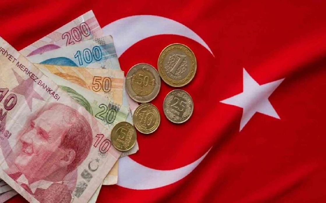 The Turkish lira hits a record low of 16 lira to the dollar after the interest rate cut